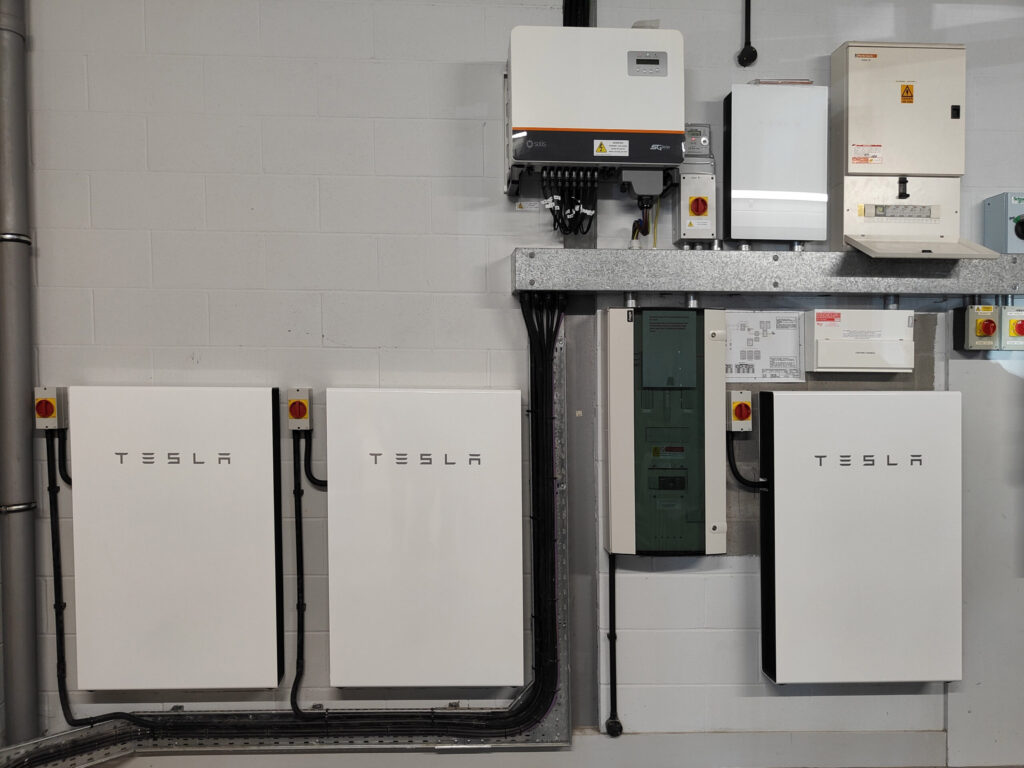 Three Tesla Powerwall Battery Storage Systems installed within the inside of Nairn Community & Arts Centre.