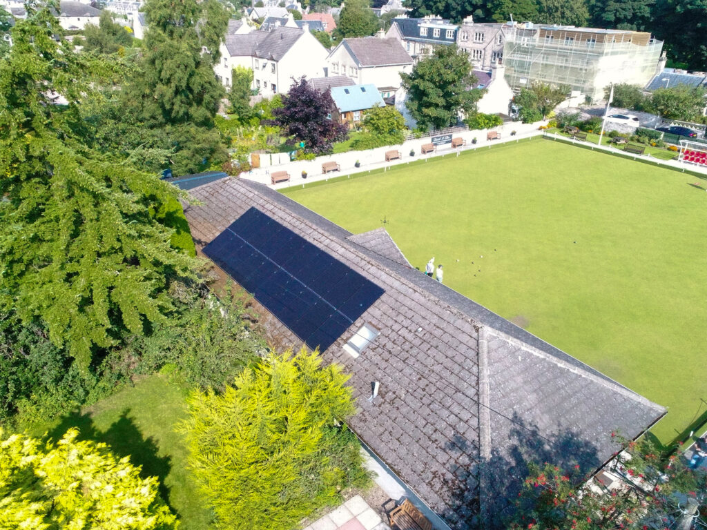 Aerial shot of Nairn Bowling Club green with solar PV on the roof.