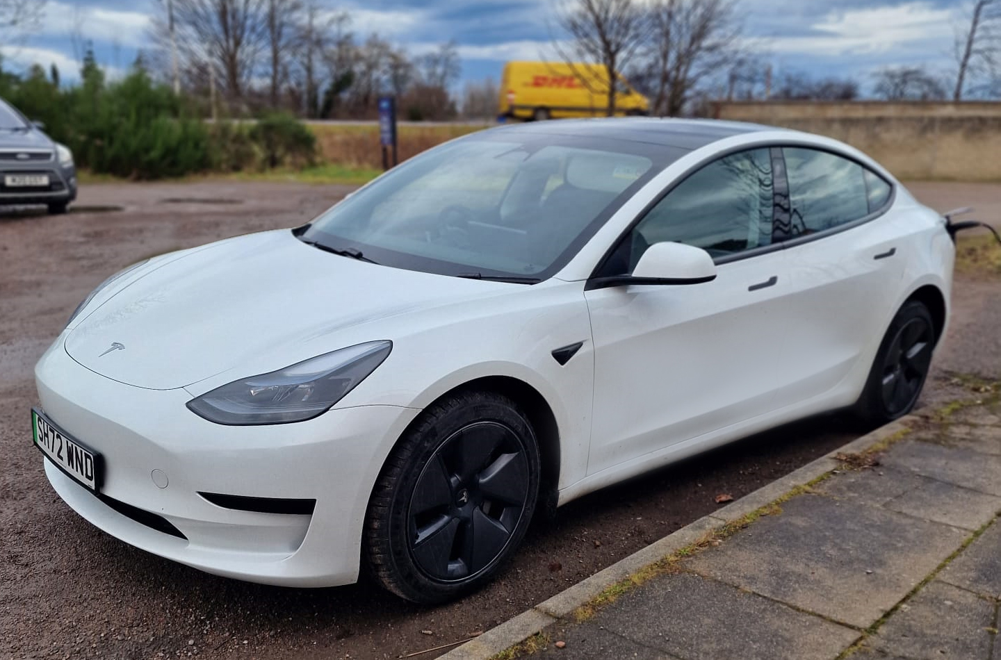 AES Solar on the road with a blank Tesla Model 3 ready to be branded