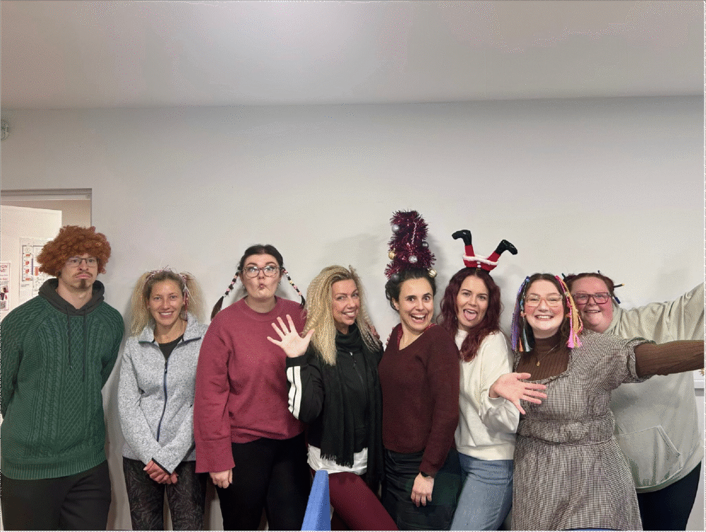 Making a difference for Mikeysline as a group of people featuring crazy hair dos for charity pull a funny face for the camera.